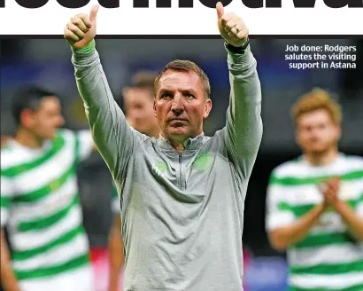 ??  ?? Job done: Rodgers salutes the visiting support in Astana