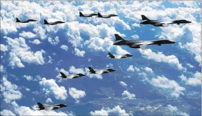  ??  ?? South Korea Defense Ministry via The Associated Press U.S. Air Force B-1B bombers, F-35B stealth fighter jets and South Korean F-15K fighter jets fly Monday over the Korean Peninsula.