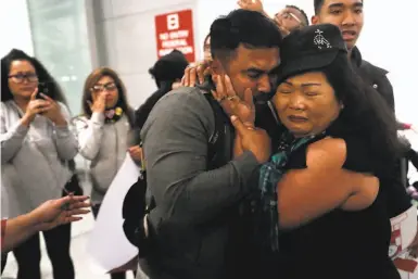  ?? Photos by Scott Strazzante / The Chronicle ?? Sok Loeun embraces his mother, Nagh Meas, at S.F. Internatio­nal Airport after about five years living in Cambodia. Mistakenly targeted for deportatio­n in 2015, Loeun didn’t know that he was already a U.S. citizen.