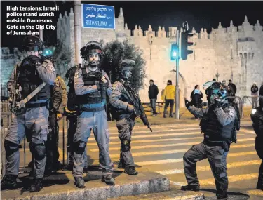  ??  ?? High tensions: Israeli police stand watch outside Damascus Gate in the Old City of Jerusalem