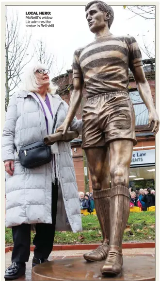  ?? ?? LOCAL HERO: McNeill’s widow Liz admires the statue in Bellshill