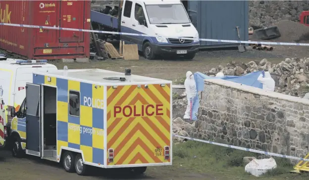  ??  ?? 0 Forensic officers at the scene at Whitecross, outside Linlithgow after a wall collapsed on workers who were believed to be rebuilding an old barn