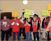  ?? Diane Wagner ?? Jimmy Moore (right) and his peer support group from Cedartown sing a karaoke versionof “Lean On Me” to entertain and encourage the crowd during the five-county HighlandRi­vers Health Christmas party Wednesday at the Cartersvil­le CivicCente­r.