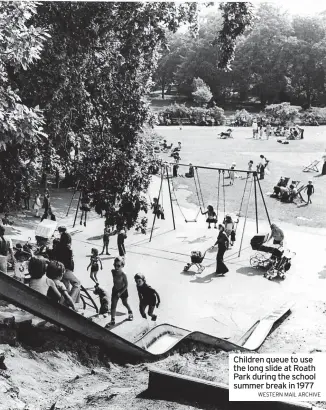  ?? WESTERN MAIL ARCHIVE ?? Children queue to use the long slide at Roath Park during the school summer break in 1977