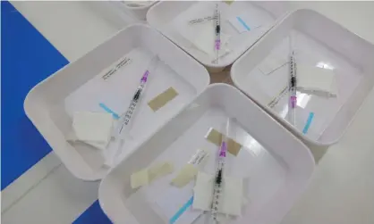  ?? Photograph: Sean Gallup/Getty Images ?? Syringes filled with half doses of the Moderna vaccine for booster shots against Covid-19, pictured at a Berlin facility.