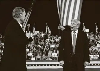  ?? Andrew Caballero-Reynolds / AFP via Getty Images ?? Sen. David Perdue shares the stage with President Donald Trump during a Saturday rally at Valdosta Regional Airport to support the Georgia Republican senators facing runoffs in January.