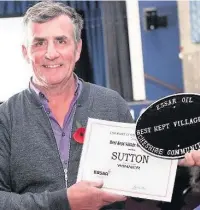  ?? ?? Sutton Parish Council Chairman Andrew Waller with the award