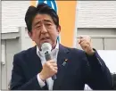  ?? The Associated Press ?? Japan’s former Prime Minister Shinzo Abe makes a campaign speech just before being shot from behind.