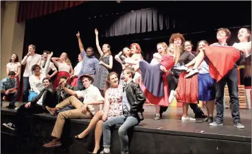  ?? Kristina Wilder / Rome News-Tribune ?? The cast of “All Shook Up” poses at the end of a dance number during a rehearsal. The show will open tonight at 7 p.m.