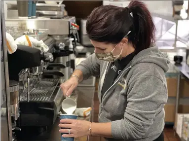  ?? MARAH MORRISON — THE NEWS-HERALD ?? Meghan Coyne Wickline, manager and co-owner alongside her brothers of Fiona’s Coffee Bar and Bakery, making a tiramisu latte. Before she partnered with her brothers, she was in a different field of work.