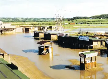  ?? PHOTOS: LEADER-POST FILES ?? Flooding on Main Street in 1991. Flooding has hit the Jamboree several times.