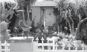  ?? David Crane/Los Angeles Daily News via AP ?? ■ Surrounded by a white picket fence, this photo shows the front entrance of Robert Chain’s house Thursday in the Encino section of Los Angeles.