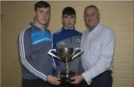  ??  ?? Con O’Callaghan with Blessingto­n GAA’s Under-15 Player of the Year award winner Oisin Brogan with the Pat Fanning Cup presented by Tom Hennessy at the club’s underage awards. Photo: Barry Hamilton.