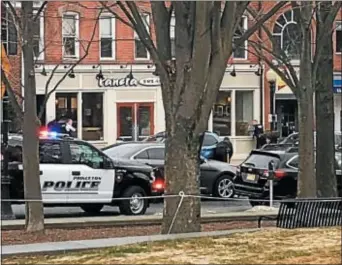  ?? TWITTER IMAGE ?? Officers with their guns drawn outside the Panera Bread in Princeton on Tuesday morning responding to a report of an armed man in the restaurant.