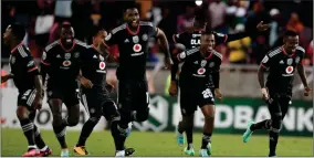  ?? (Source: Daily Mail) ?? Orlando Pirates players celebrate their victory against Dondol Stars during their Nedbank Cup game at the Peter Mokaba Stadium on Saturday afternoon.