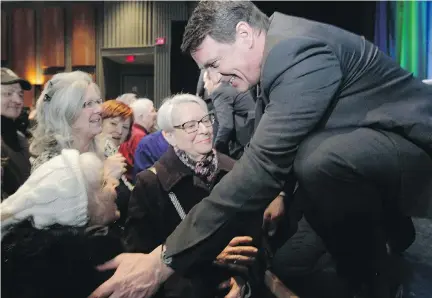  ?? J O H N K E N N E Y/ MO N T R E A L G A Z E T T E ?? Parti Québécois leadership hopeful Pierre Karl Péladeau greets supporters: “I didn’t think public life could be so demanding,” he admitted.