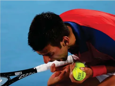  ?? Exander Zverev yesterday (Reuters) ?? Novak Djokovic reacts during his semi - fina l defeat by A l