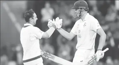  ?? ?? Travis Head, left, who made a century, and Cameron Green, who made a classy 74, were responsibl­e for Australia’s fightback. (Photo courtesy Cricket Australia)