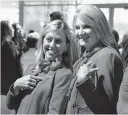  ?? Daniel Carde / Tribune News Service ?? Southwest Airlines flight attendants Shari Rood, left, and her friend, Linda Clark, show their wings after Rood’s graduation Friday in Dallas.