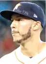  ?? David J. Phillip/ AP file photo ?? ■ Houston Astros shortstop Carlos Correa wears a message on his cap during a Sept. 23, 2017, Major League Baseball game for those affected by Hurricane Maria that ravaged Puerto Rico last fall.