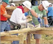  ?? ADRIAN SAINZ / ASSOCIATED PRESS ?? Former President Jimmy Carter (center) works on a Habitat for Humanity constructi­on project on Monday in Memphis, Tenn. Carter said he thought he had just a few weeks to live during his battle with cancer a year ago. “The doctors are still keeping an...