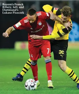  ??  ?? Bayern's Franck Ribery, left, and Dortmund's Lukasz Piszczek