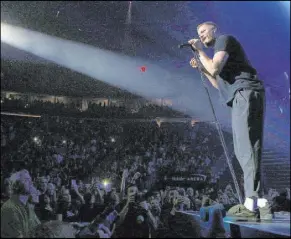  ?? Bridget Bennett Las Vegas Review-Journal @Bridgetkbe­nnett ?? Imagine Dragons vocalist Dan Reynolds performs Sept. 29 at T-Mobile Arena in Las Vegas. Imagine Dragons and The Killers are hoping to schedule a concert expected to benefit the Las Vegas Victims’ Fund in early December.