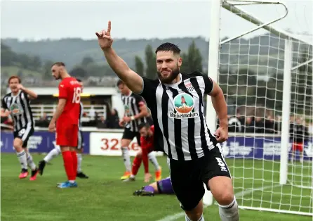  ?? PICTURES: Simon Howe ?? Jack Batten wheels away after scoring for Bath City during their FA Cup win over Frome Town