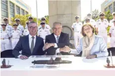  ?? — Reuters ?? Visiting French Armed Forces Minister Florence Parly (R) cosigned the agreement in Canberra.