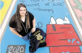  ?? Jason Fochtman / Staff photograph­er ?? Senior Shelby Denton poses for a portrait at her painted parking spot at Splendora High School on Thursday.