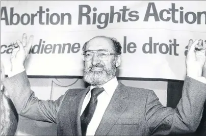  ?? BLAISE EDWARDS/CANADIAN PRESS FILE ?? Dr. Henry Morgentale­r raises his arms in victory at a news conference in Toronto, Ont., Jan. 28, 1988. This January marks 30 years since the Supreme Court of Canada struck down the country’s abortion law as unconstitu­tional.