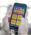  ?? BEVAN READ/FAIRFAX NZ ?? Lotto Scratch cards could soon be available on your mobile phone if the Lotteries Commission gets its way.