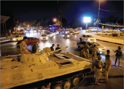  ?? THAIER AL-SUDANI / REUTERS ?? Iraqi soldiers take part in an intensive security deployment following a drone attack on the prime minister’s residence in Baghdad on Nov 7. Military interventi­on in the country has caused harm, not ‘democratic transforma­tion’.