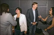  ?? JAY JANNER / AMERICAN-STATESMAN ?? Democratic gubernator­ial candidates Lupe Valdez (left) and Andrew White mingle with voters at the Jolt Texas Town Hall on April 29. They will debate Friday in East Austin.