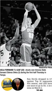  ?? ASSOCIATED PRESS ?? UCLA FORWARD TJ LEAF (22) shoots over Arizona State forward Obinna Oleka (5) during the first half Thursday in Tempe.