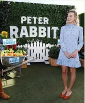  ?? (Reuters) ?? CAST MEMBER Margot Robbie poses at a photo call for ‘Peter Rabbit’ in West Hollywood on February 2.