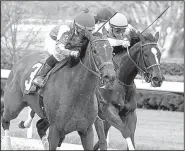  ?? The Sentinel-Record/RICHARD RASMUSSEN ?? Richard Eramia and Cosmic Burst (left) pass Amy’s Challenge (6) and Jareth Loveberry to win the Honeybee Stakes at Oaklawn Park in Hot Springs on Saturday.