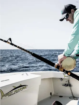  ??  ?? Heavy tackle is the name of the game for subduing giant bluefin tuna. Crews troll a combinatio­n of 80- and 130-wide reels spooled with heavy mono connected to 300- to 400-pound leaders. They use a combinatio­n of SeaWitches and Ilanders (below) over...