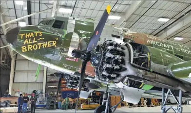  ?? ALEX RONALLO / ASSOCIATED PRESS ?? The plane dubbed “That's All, Brother” is shown during the restoratio­n process in Oshkosh, Wisconsin, on Thursday. The C-47 aircraft carried the first paratroope­rs who stormed the beaches of Normandy during World War II but had been lost for 70 years...