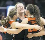  ?? James Crisp/Associated Press ?? Oregon State’s Mikayla Pivec, Marie Gulich and Kat Tudor, from left, celebrate after Oregon upset Baylor Friday night in Lexington, Ky.