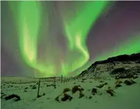  ?? AP file ?? The Northern Lights, or aurora borealis, appear in the sky over Bifrost, Western Iceland. —