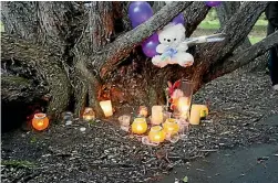  ?? PHOTO: FAIRFAX NZ ?? A candlelit vigil was held on Sunday evening at the site where an abandoned baby was found.