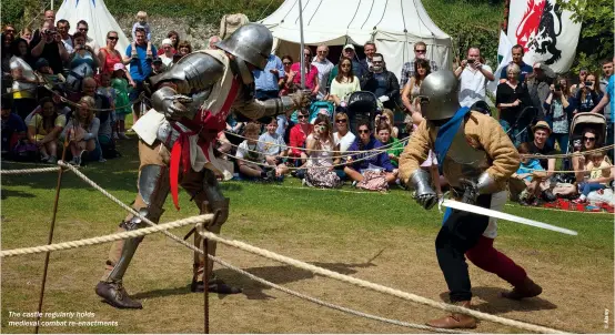  ??  ?? The castle regularly holds medieval combat re-enactments