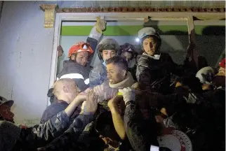  ??  ?? RISHI KHANAL, an injured survivor, is taken out by French rescue teams from a damaged building following Saturday’s earthquake in Kathmandu, Nepal on April 28.