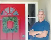  ?? P PHOTO/JOHN RAOUX ?? Bob Garick stands by the entrance to his home Wednesday in Oviedo, Fla.