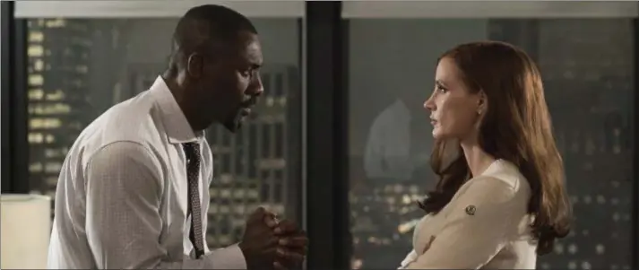  ??  ?? Idris Elba and Jessica Chastain star in “Molly’s Game.” STXFILMS