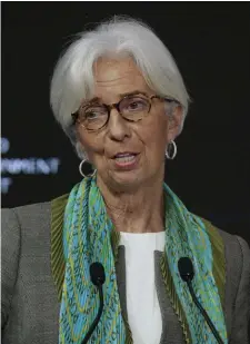  ??  ?? IMF boss Christine Lagarde said: ‘I’m ringing not the alarm signal, but the strong encouragem­ent and warning signal.’