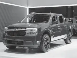  ?? SCOTT OLSON/GETTY ?? A new Ford Maverick truck is introduced to the media at the Chicago Auto Show on July 14.