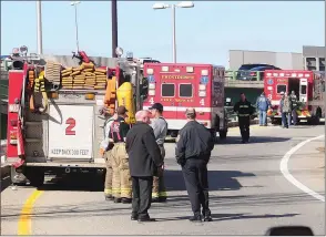  ?? Photo by Ernest A. Brown ?? Providence Fire and Rescue crews arrive on the scene of a police shooting on the Memorial Boulevard on-ramp to Route 95 near the Providence Place Mall Thursday morning.