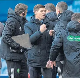  ??  ?? Steven Gerrard with Celtic assistant manager, John Kennedy, at time up